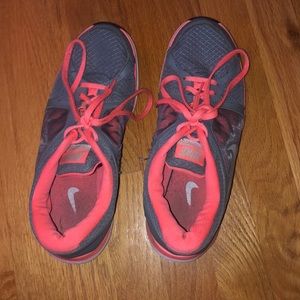 Gray and orange Nike shoes